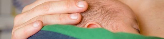 Foto Baby im Tragetuch